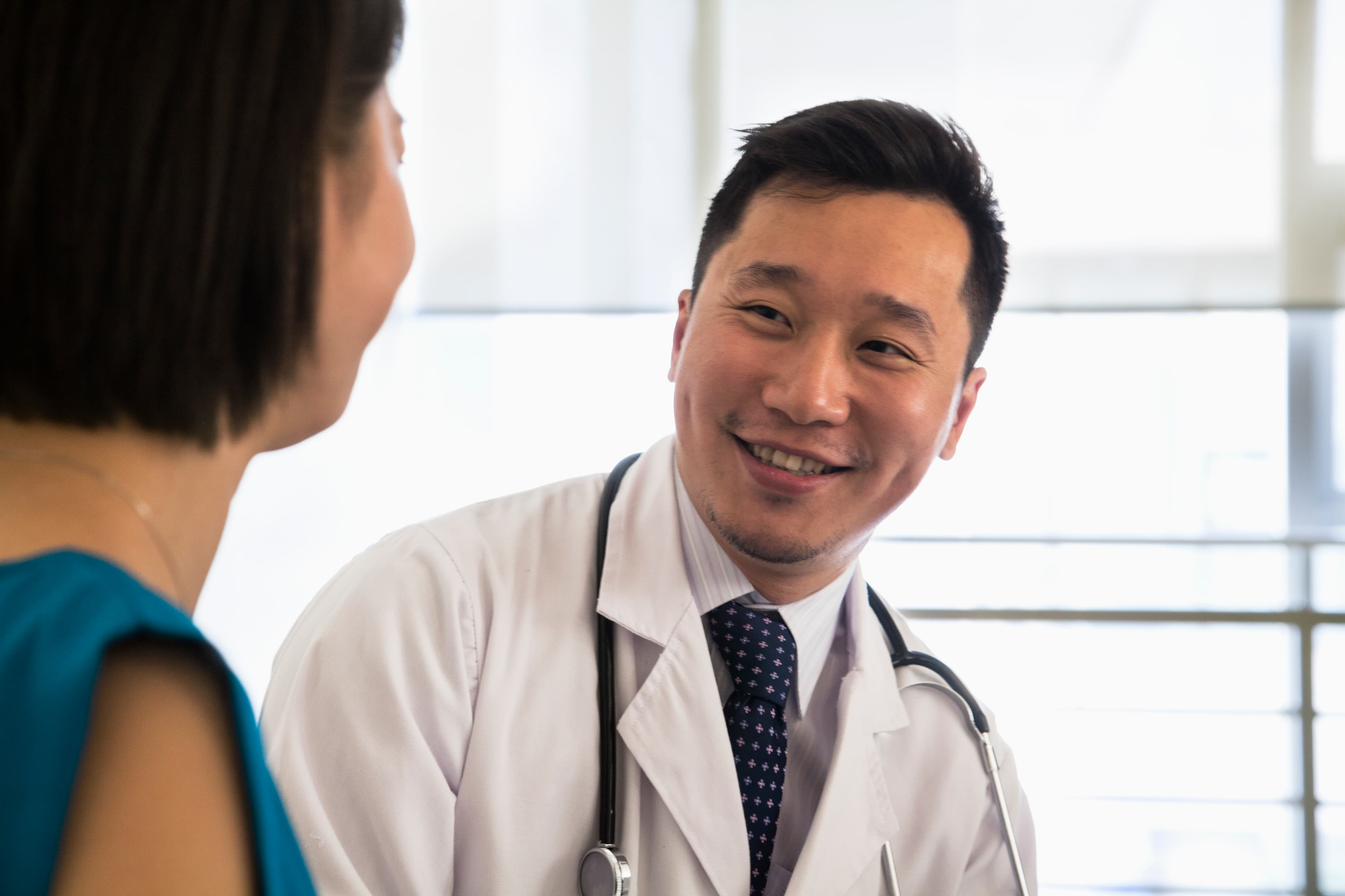 Male General Medicine Physician with female patient