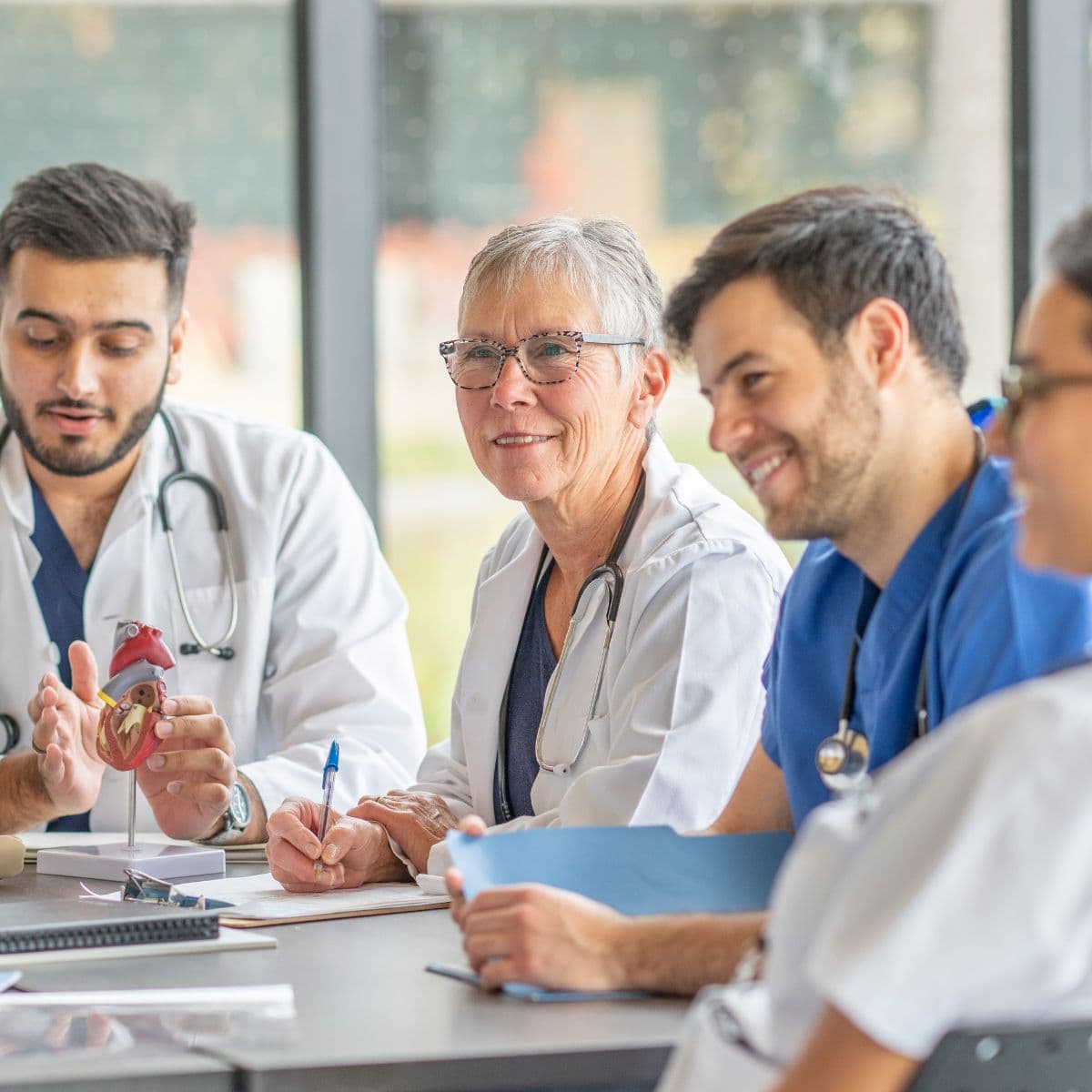 Employers meeting of doctors around table