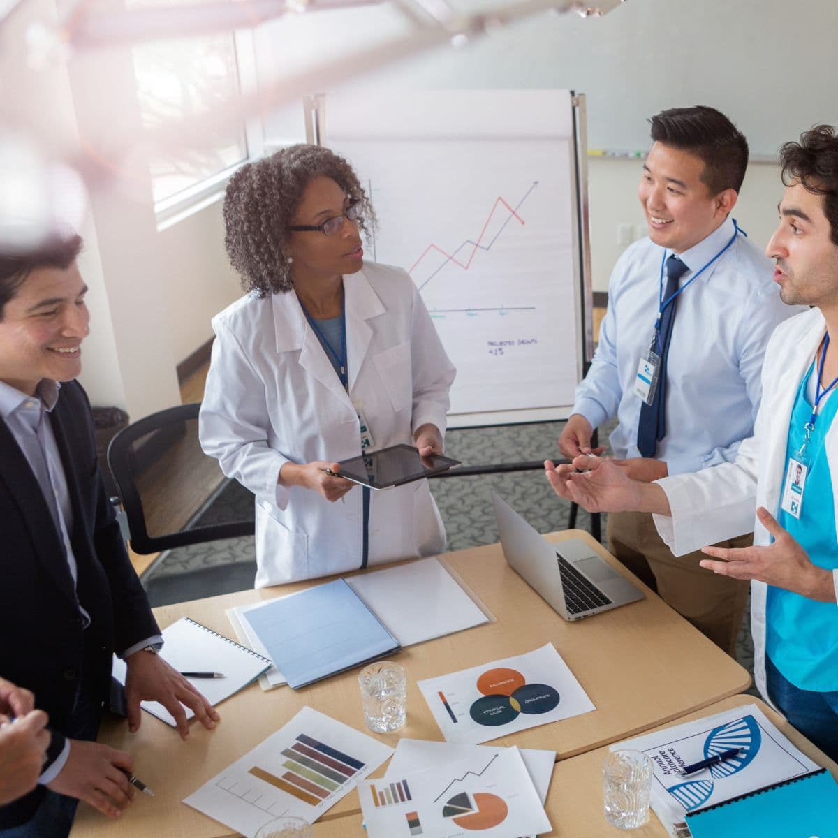 Employers group of doctors standing at table
