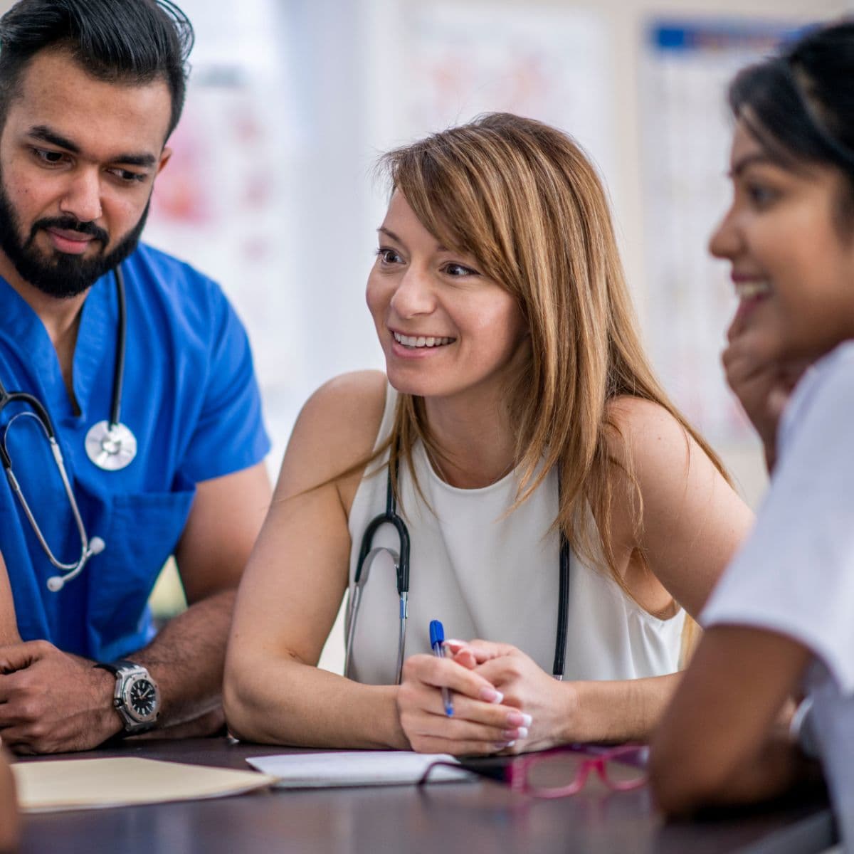 Female physician talking to team