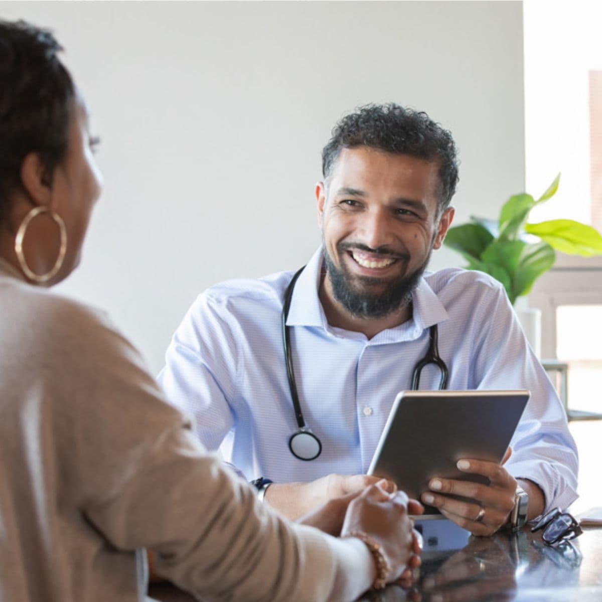 Male GP with patient