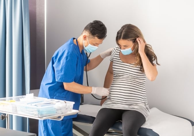 O&G registrar with patient