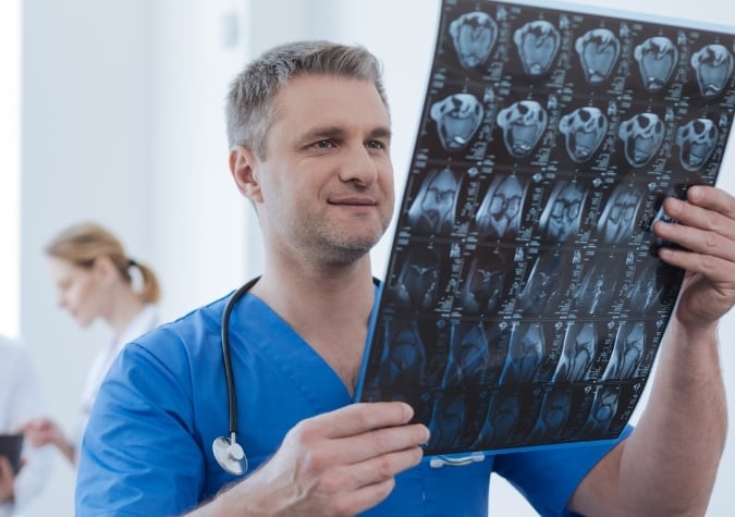 radiologist with x ray