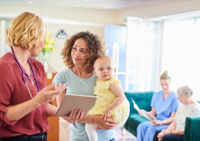 paed consultant with mother and baby