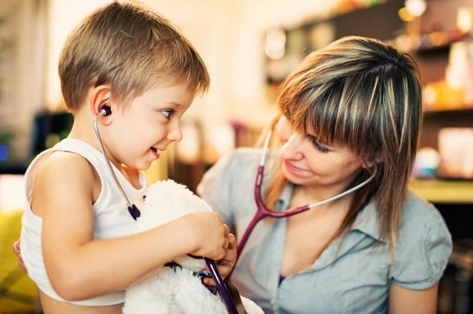 woman GP with young boy patient
